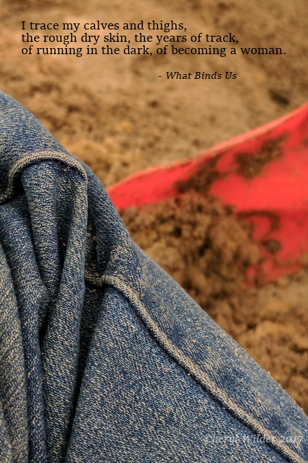 closeup of jeans pant leg on sand