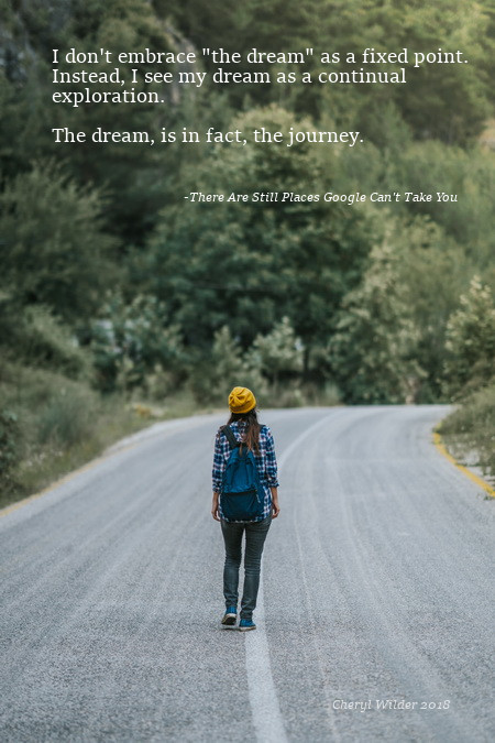 woman walking along down road in mountains