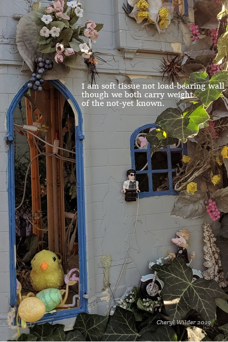 doll house front door and window with missy piigy on motorcycle and baby chick in doorway