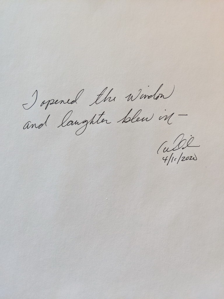 handwritten poem in cursive on plain white paper